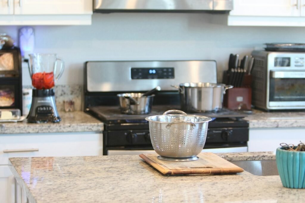 A modern kitchen countertop with appliances arranged for safe use