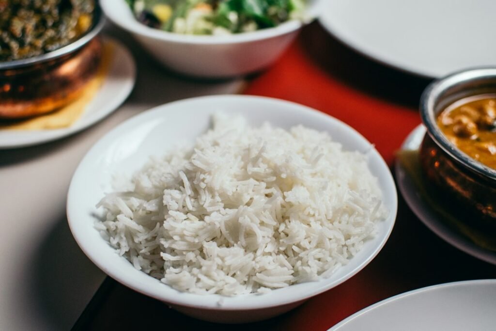 Bowl of cooked white rice, illustrating a small rice cooker comparison