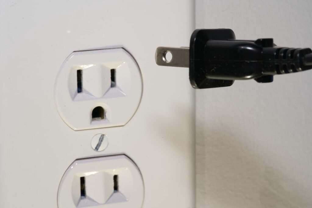 Electrical plug connected to a wall outlet