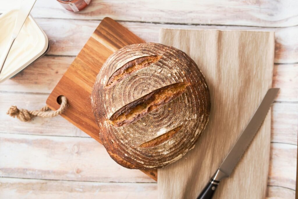 Horizontal loaf of bread on a wooden cutting board