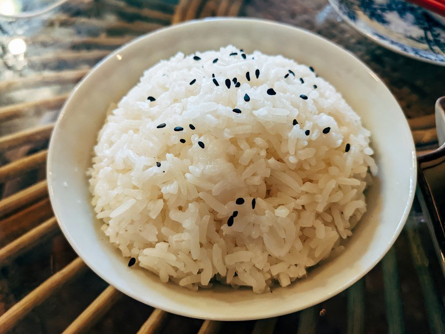 White rice topped with black sesame seeds