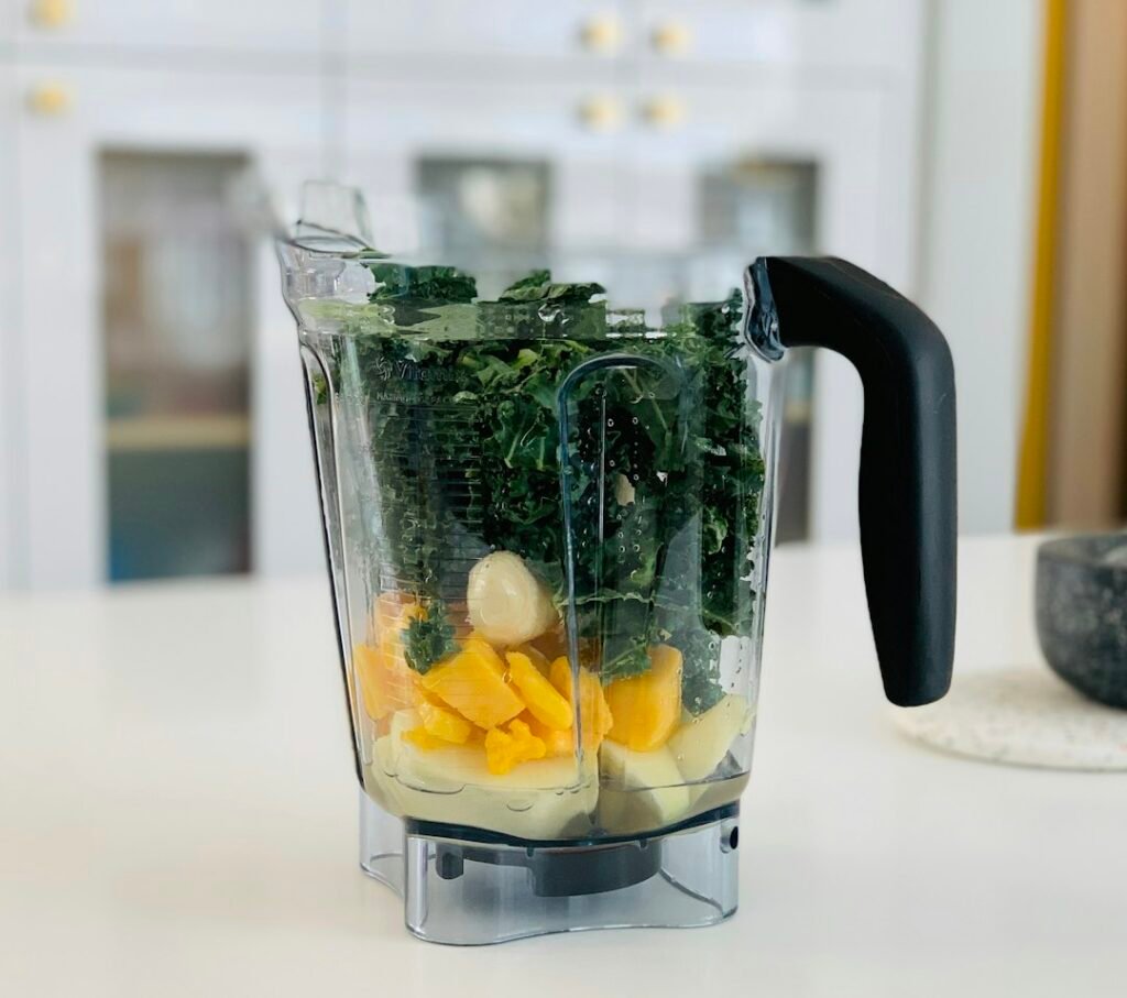 Smoothie preparation, illustrating the mini food processor vs blender comparison