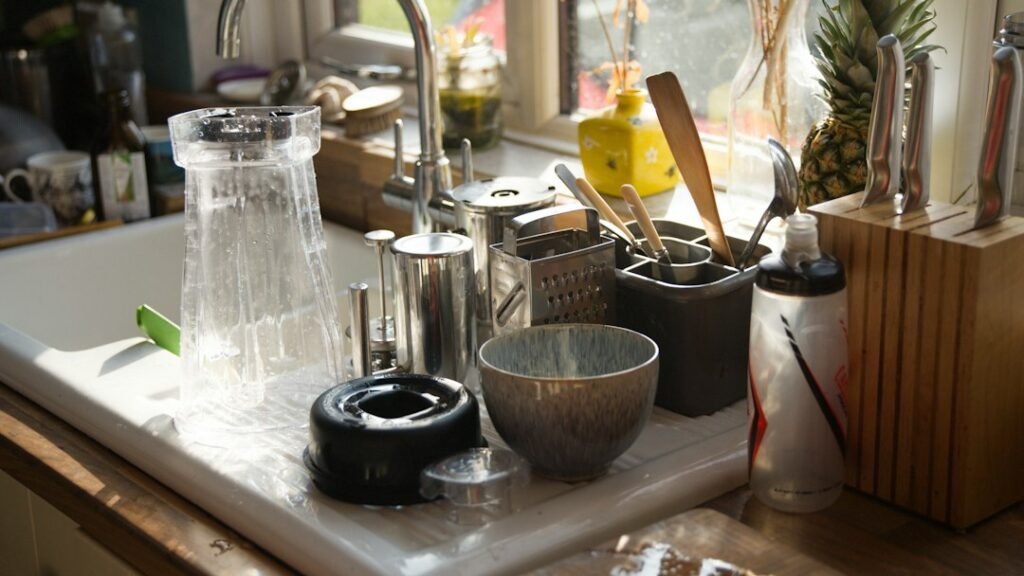 Kitchen sink and utensils illustrating safe personal blender cleaning