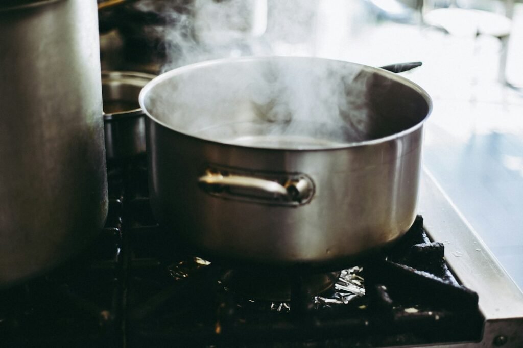 Cooking pot on a compact cooktop, illustrating a portable induction cooktop that shuts off