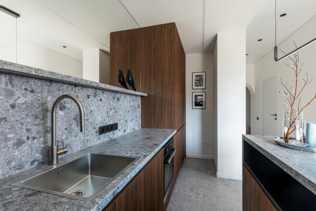 A compact apartment kitchen counter with room for a portable induction cooktop