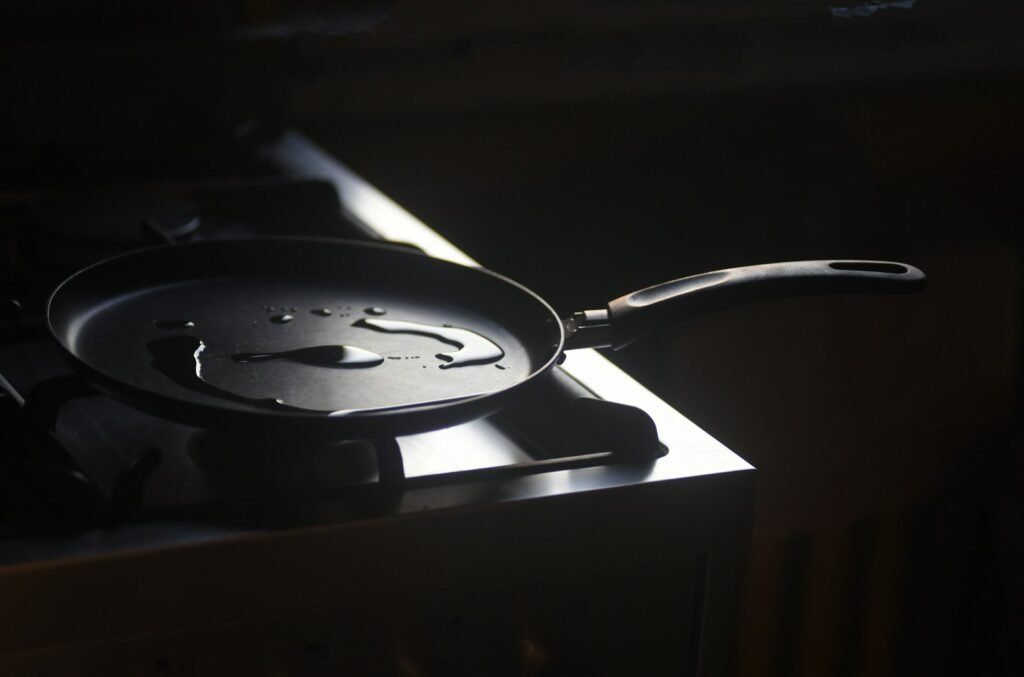 Cooking eggs in a pan on a cooktop