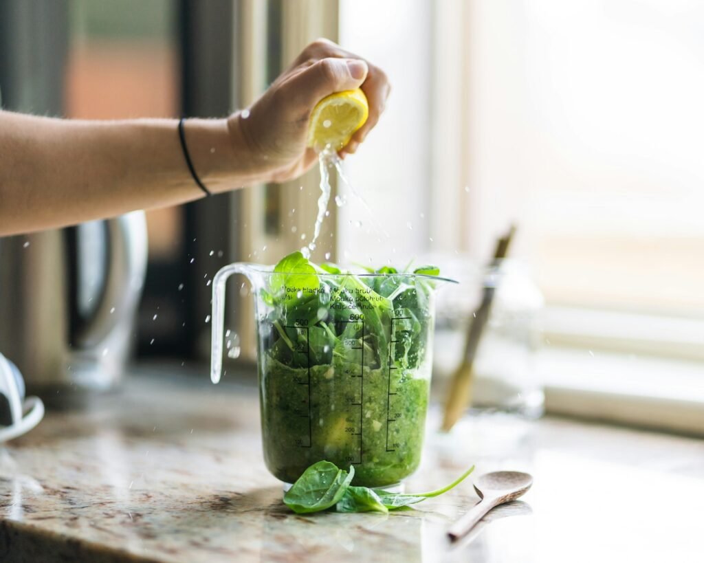 Fresh smoothie made in a blender on a kitchen counter