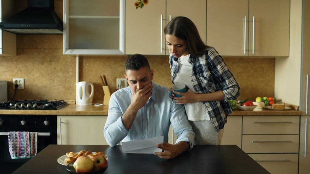 Household reviewing bills while planning a small kitchen appliance budget